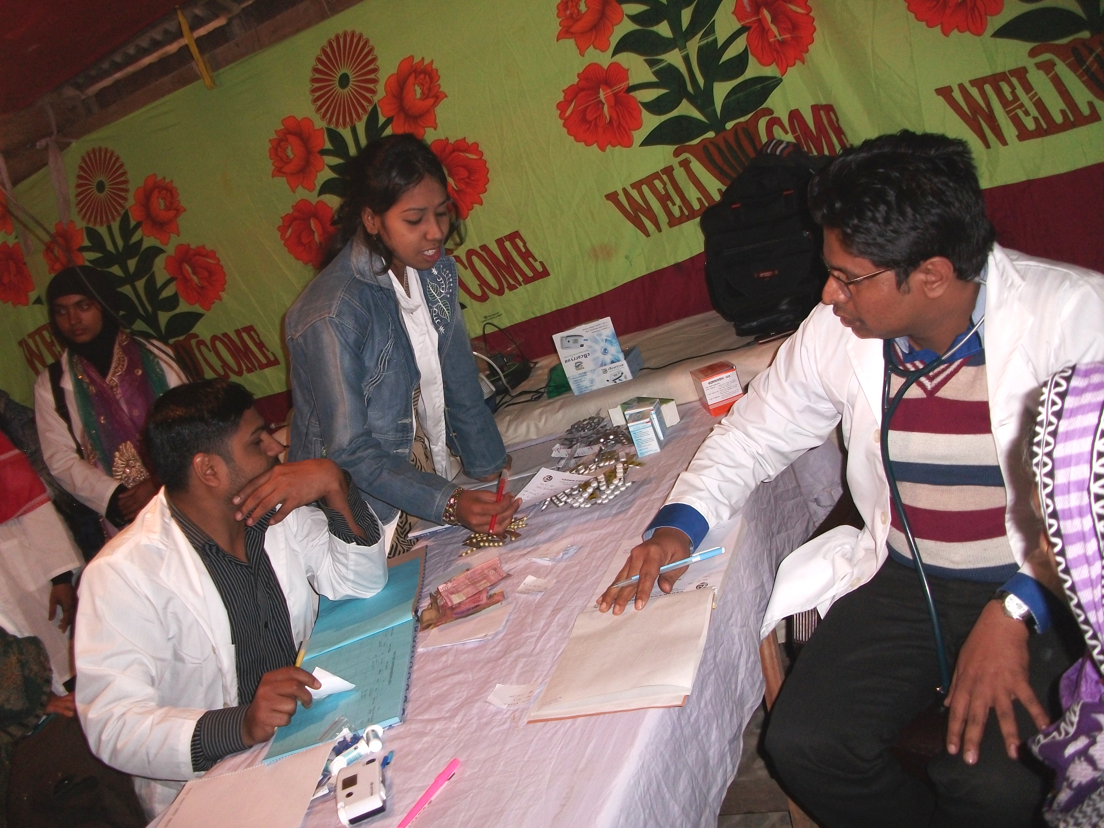 Registered doctors seeing patients at a health camp organized under the ENRICH program